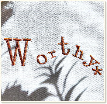 A cloth with the word "Worthy*" embroidered.